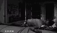 Shadowy apparition appearing in a dark room filled with paranormal instruments
