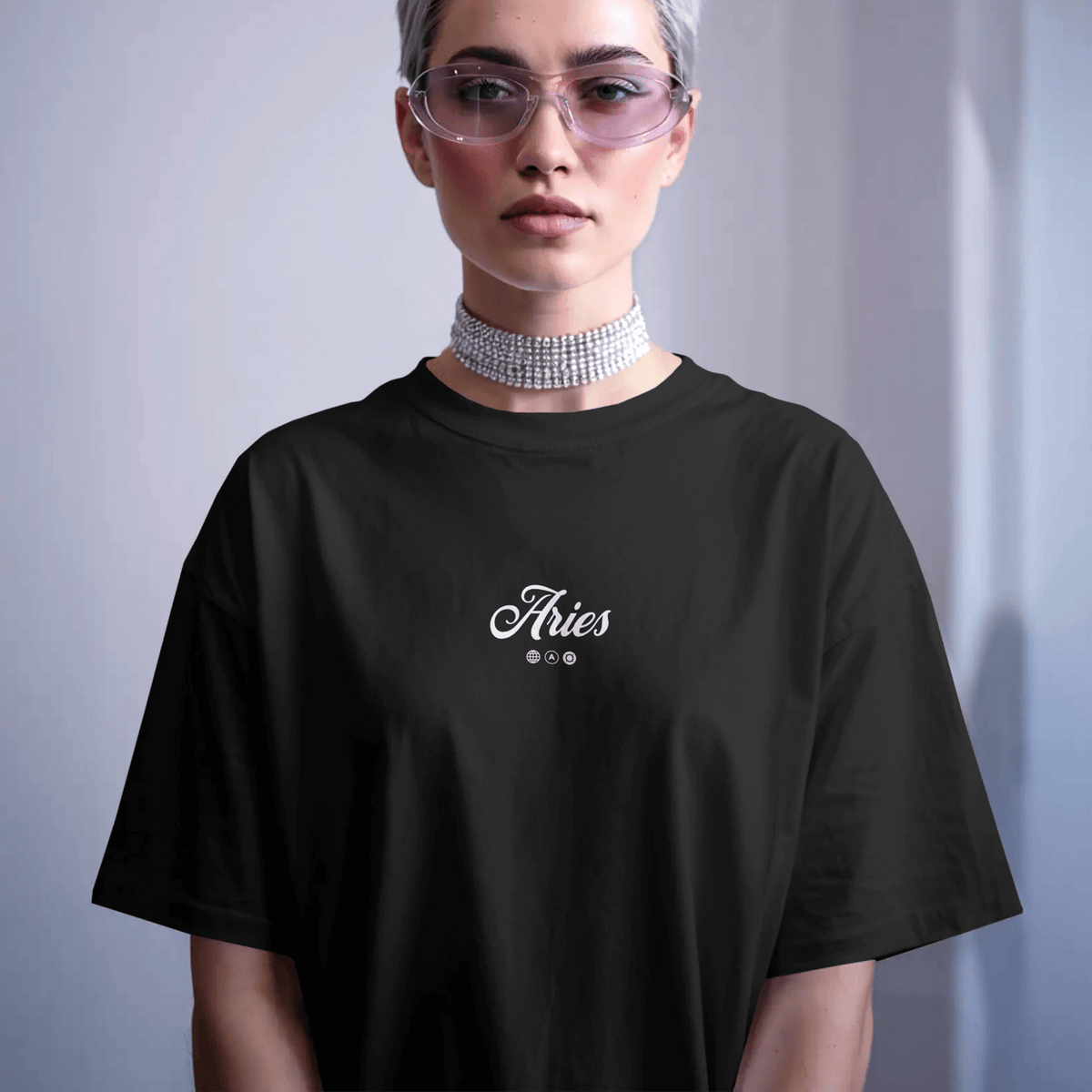 Model wearing the Aries Potion oversized zodiac T-shirt with minimalist Ram-inspired design